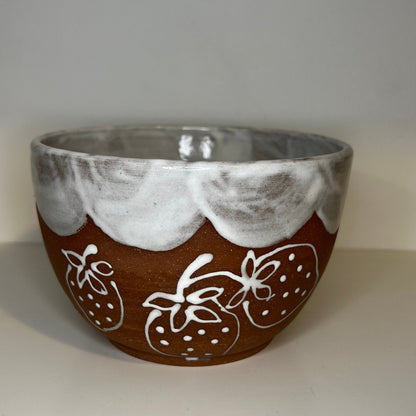 Ceramic bowl with decorative patterns on a white surface